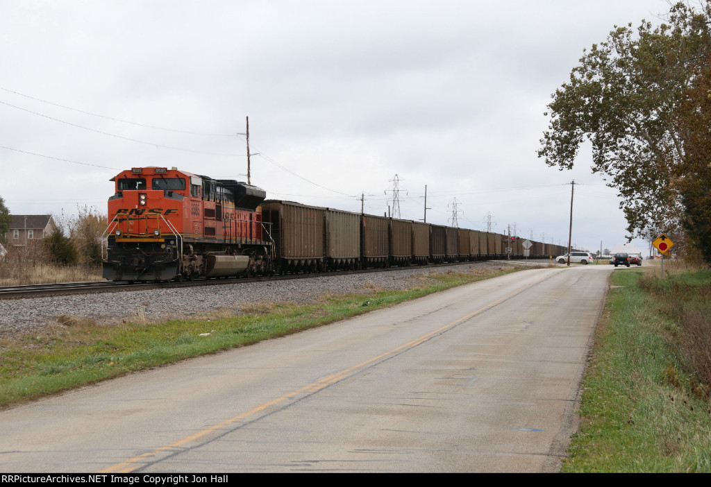 8585 heads away as the train slows for a stop at Graham